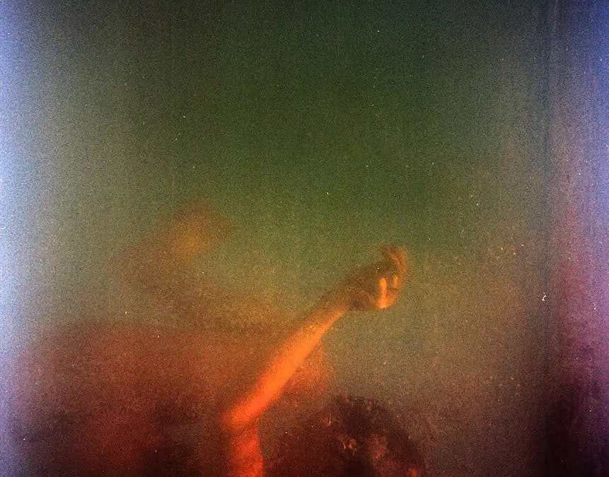 underwater view of a drowning woman