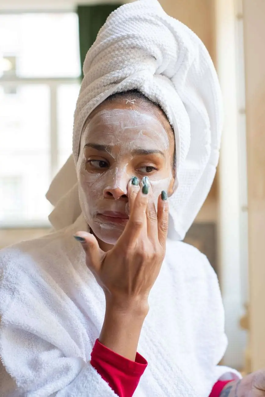 evening
beauty routines
woman applying cream on her face