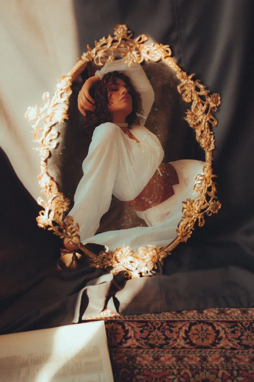artistic reflection in ornate vintage mirror