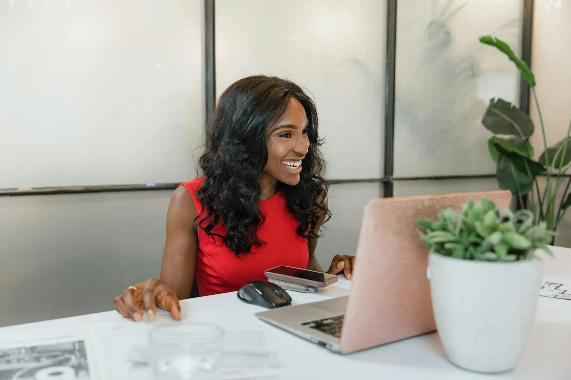 career change at 35 woman in dress sitting in front of a laptop
