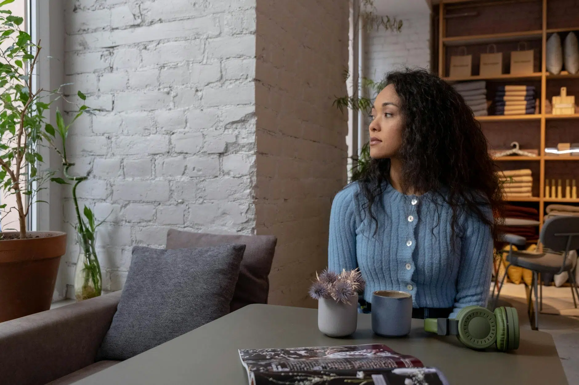 positive mindset a woman in blue sweater sitting alone