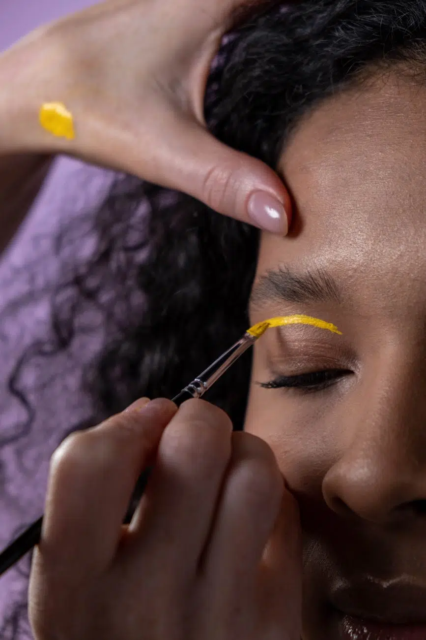 pexels-photo-6659408 beauty routine beauty as armor a woman eye lid painted with yellow