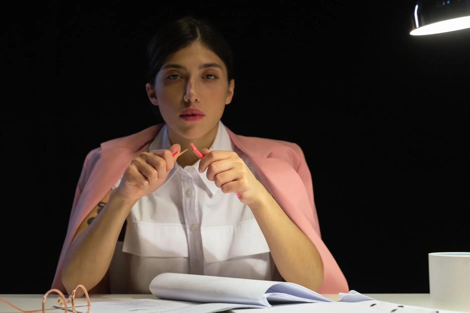 pexels-photo-9063387 overconsumption overconsuming woman in holding broken pen